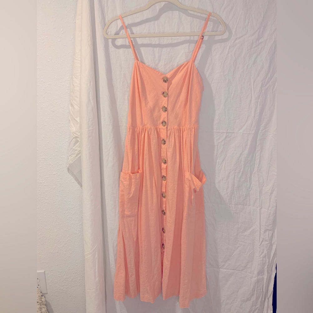 The cutest dress ever comfortable, and so flattering on! Coral pink color